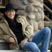 Cindy Costner's ex-husband sitting on stairs