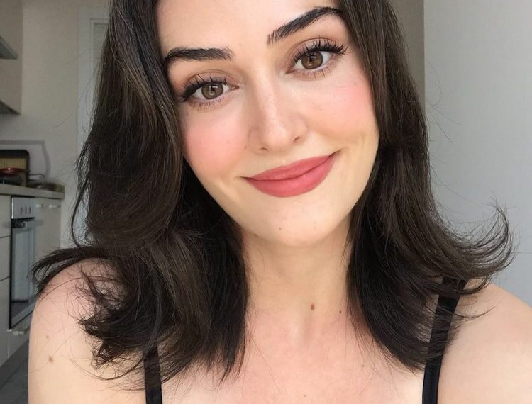 Esra Bilgiç in a black dress