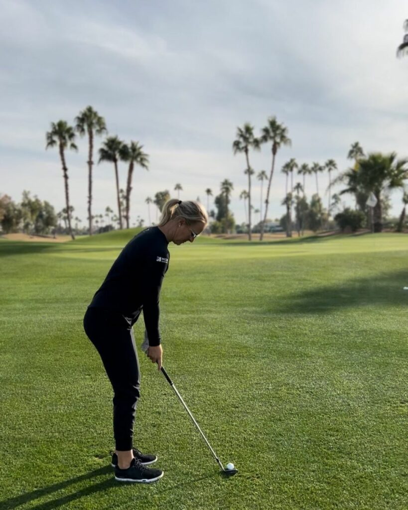 Anna playing golf