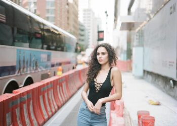 Marianly Tejada in deep neck black top