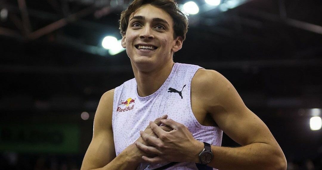 Armand Duplantis laughing with his hands on his heart