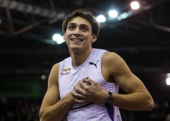 Armand Duplantis laughing with his hands on his heart