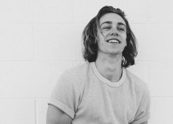 Cooper Van Grootel leaning on a wall