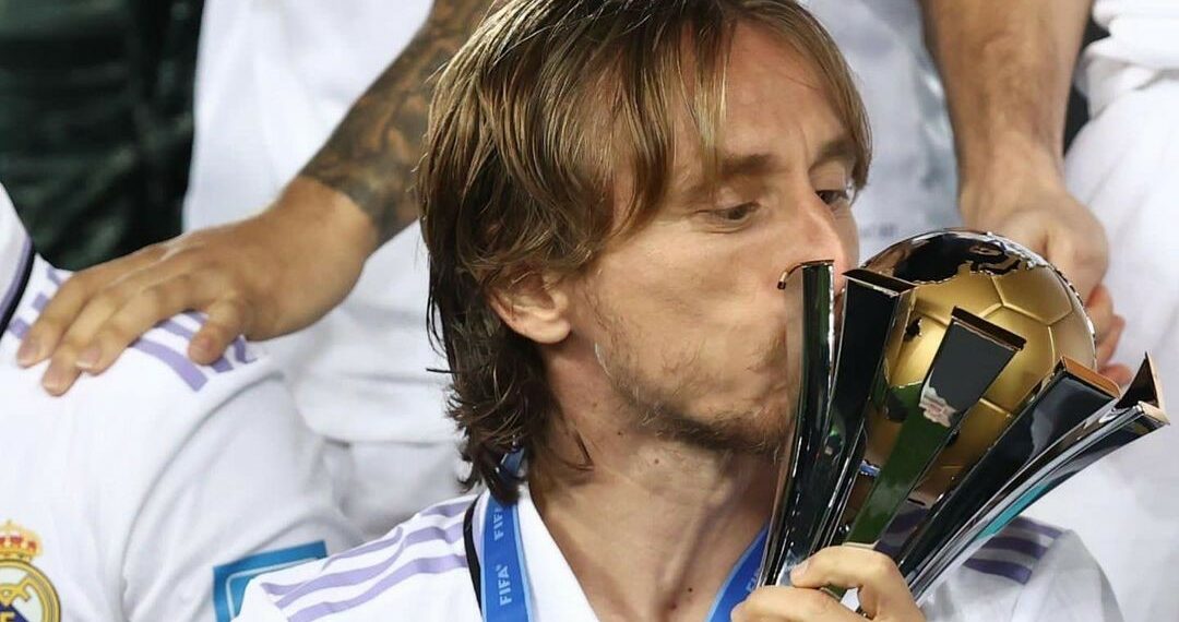 Luka Modric kissing the trophy