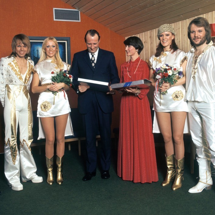 Members of ABBA with a priest