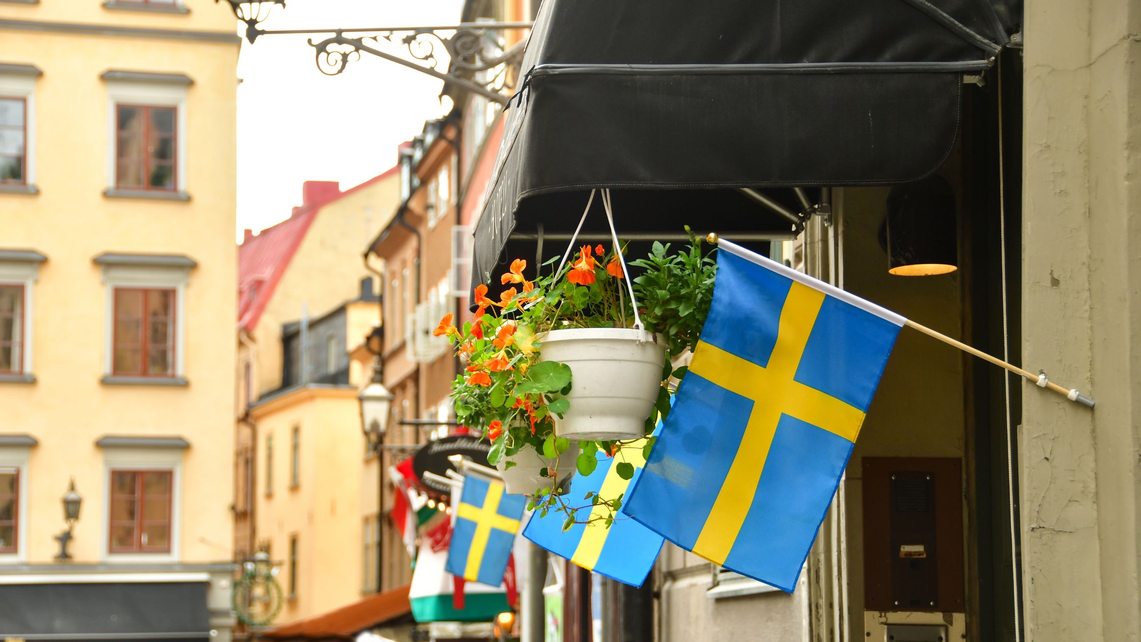 Swedish flag hanging outside a building in Sweden.