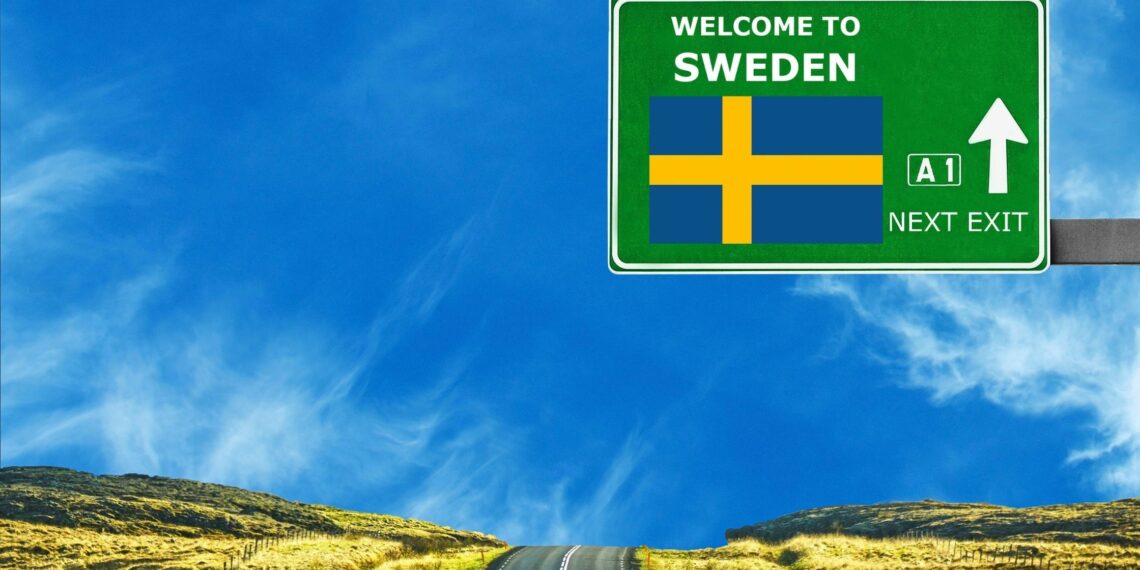 board indicating Welcome to Sweden