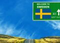 board indicating Welcome to Sweden
